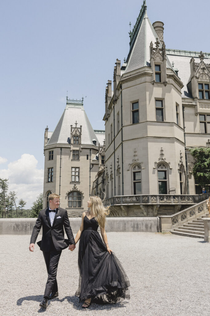Engagement photos at the Biltmore Estate with black tulle dress and black tux. Black tie engagement photos