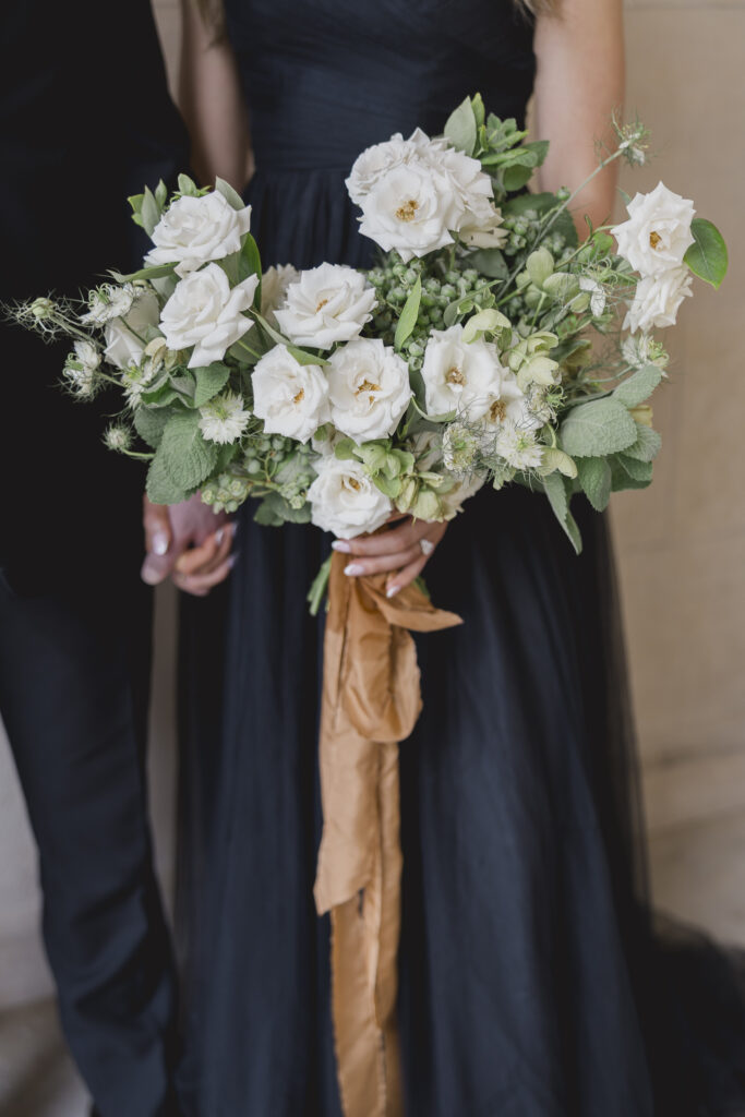 Black tie Engagement photo session at the Biltmore with black tulle dress. Rachel Deneroy Designs white floral bouquet using blueberries and mint at the Biltmore Estate.
