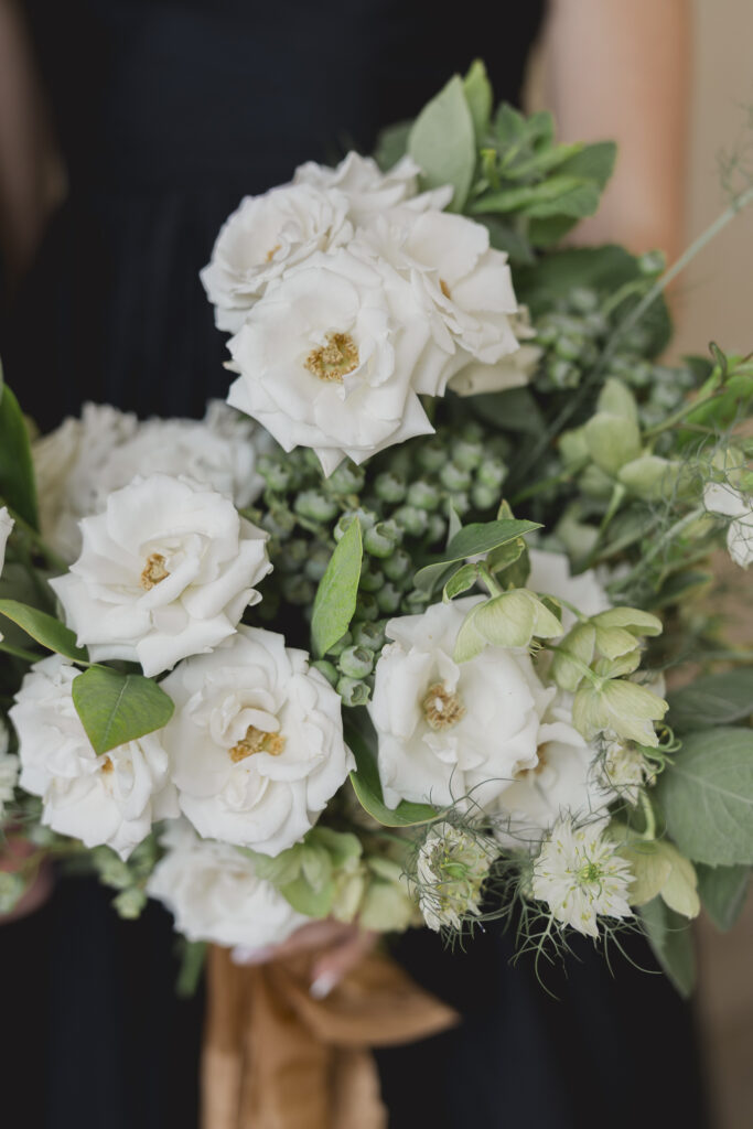 Black tie Engagement photo session at the Biltmore with black tulle dress. Rachel Deneroy Designs white floral bouquet using blueberries and mint at the Biltmore Estate.