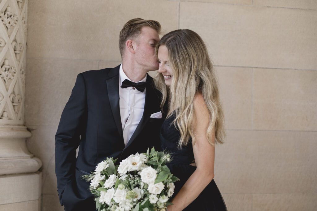 Black tie Engagement photo session at the Biltmore with black tulle dress. Rachel Deneroy Designs white floral bouquet using blueberries and mint at the Biltmore Estate.