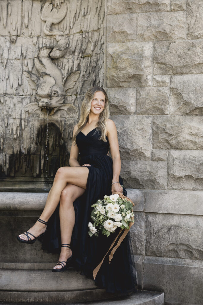 Black tie Engagement photo session at the Biltmore with black tulle dress. Rachel Deneroy Designs white floral bouquet using blueberries and mint at the Biltmore Estate.