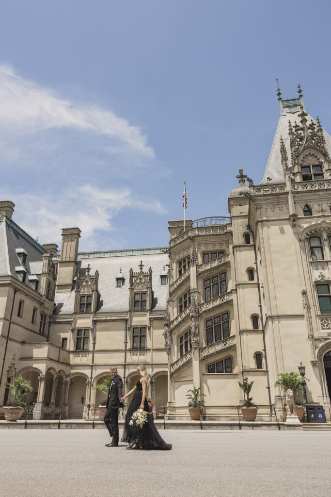 Biltmore engagement session with black tulle dress and black tux and white bouquet. Rachel Deneroy Deigns bouquet at the Biltmore