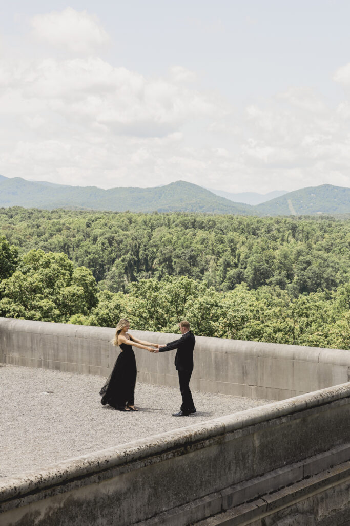 Engagement photos at the Biltmore Estate with black tulle dress and black tux. Black tie engagement photos