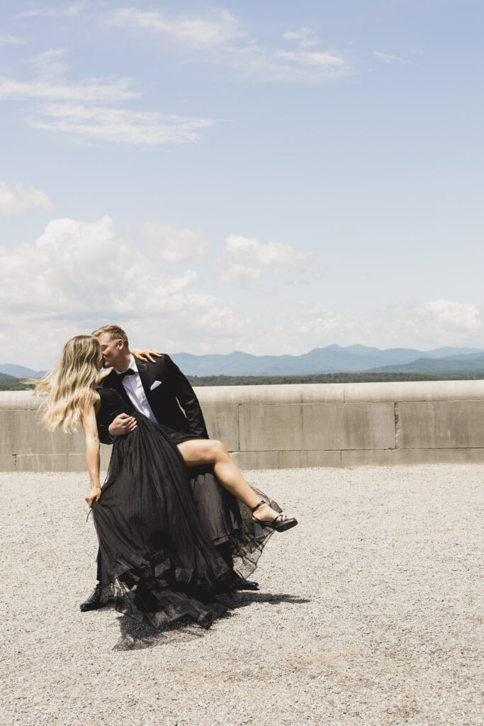 Engagement photos at the Biltmore Estate with black tulle dress and black tux. Black tie engagement photos